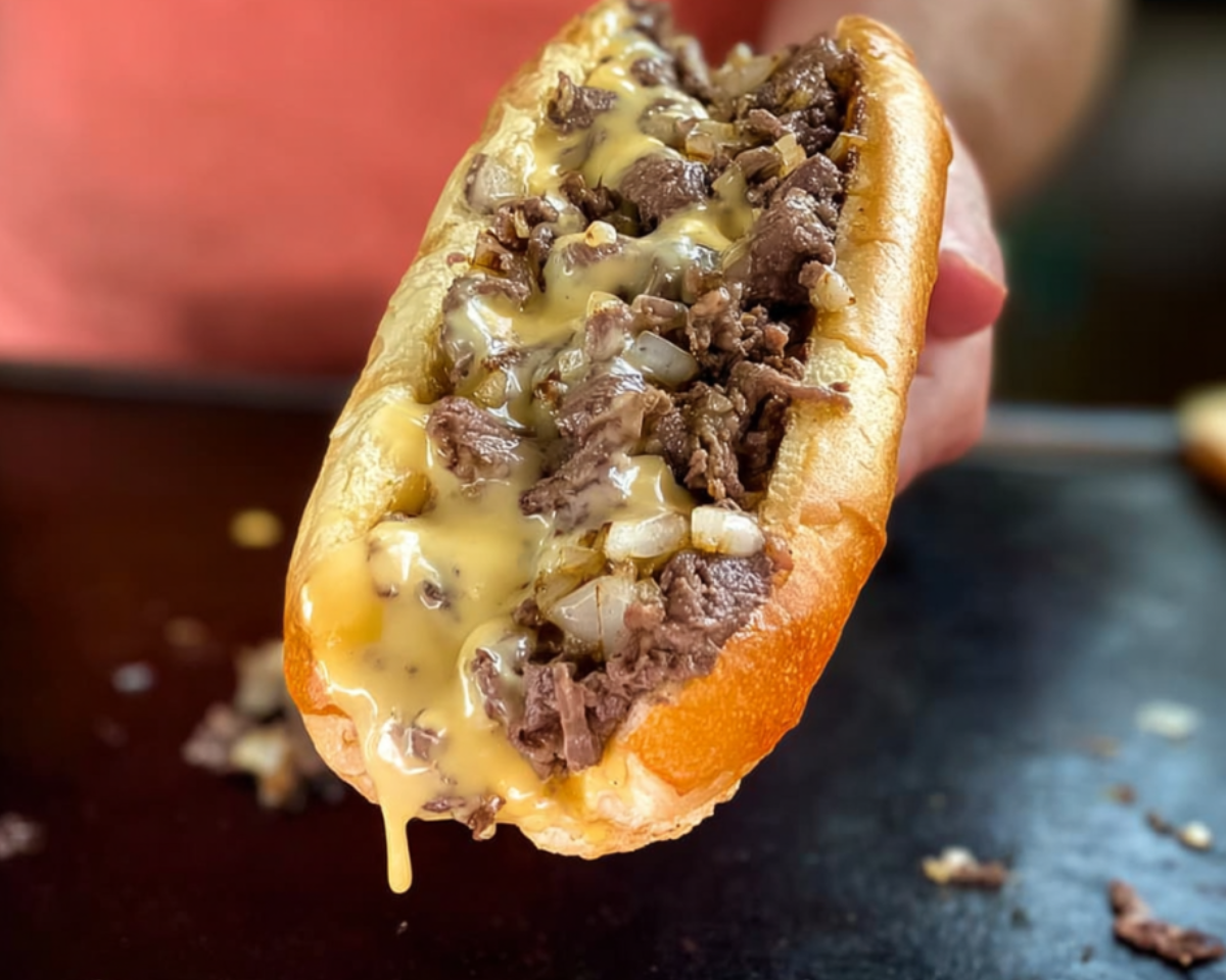 cheesesteak sandwich hand holding