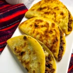 crispy beef tacos on white plate