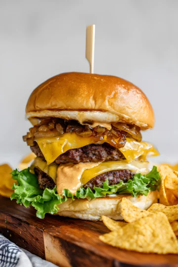 double cheeseburger with onions and chips