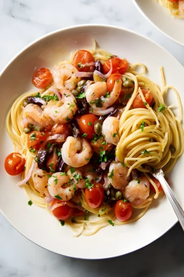 Shrimp puttanesca pasta plates