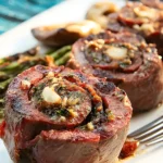 grilled stuffed steak pinwheels plate