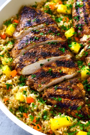 jerk chicken slices over pineapple fried rice