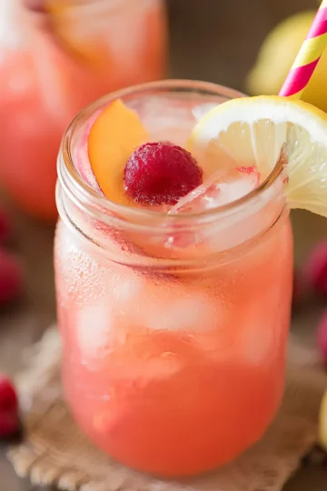 raspberry peach lemonade in mason jar
