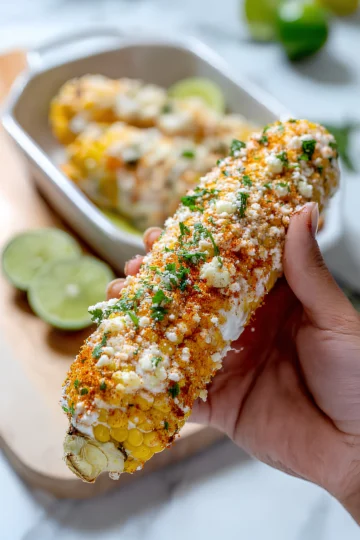 Handheld Mexican street corn