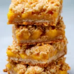 Stacked mango oatmeal crumble bars