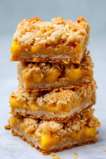 Stacked mango oatmeal crumble bars