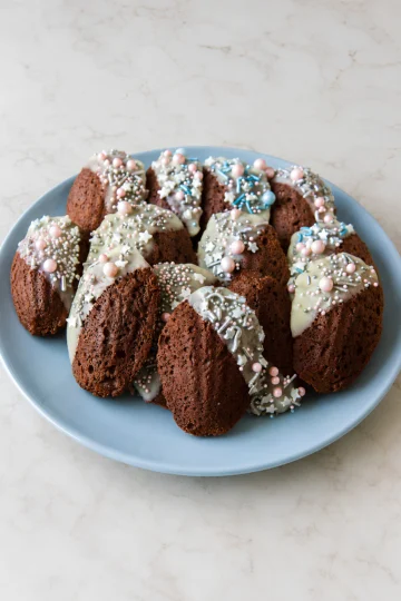 Chocolate madeleines with sprinkles